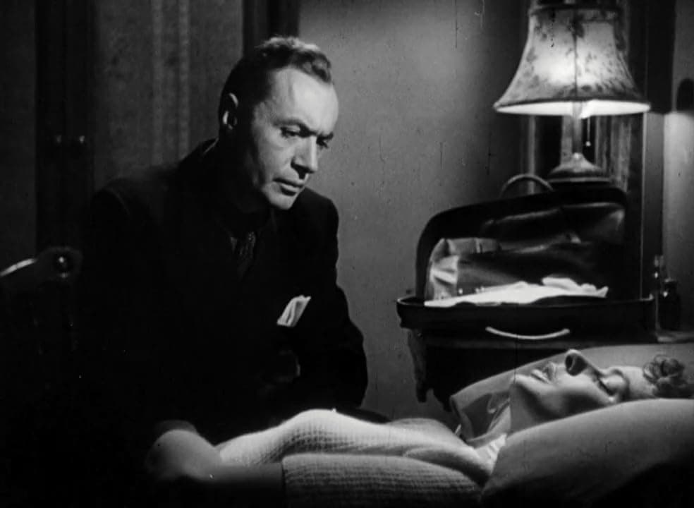 Ravic and Joan embrace